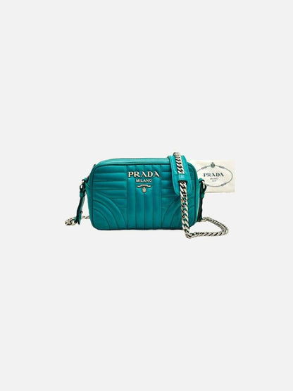 Pre - loved PRADA Diagramme Camera Turquoise Quilted Crossbody at Reems Closet