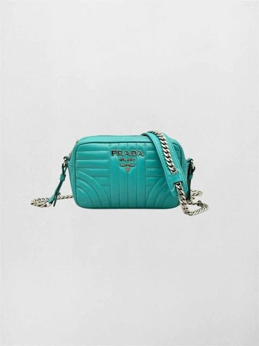 Pre-loved PRADA Diagramme Camera Turquoise Quilted Shoulder Bag at Reems Closet
