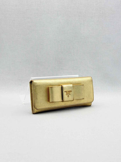 Pre-loved PRADA Gold Continental Wallet at Reems Closet