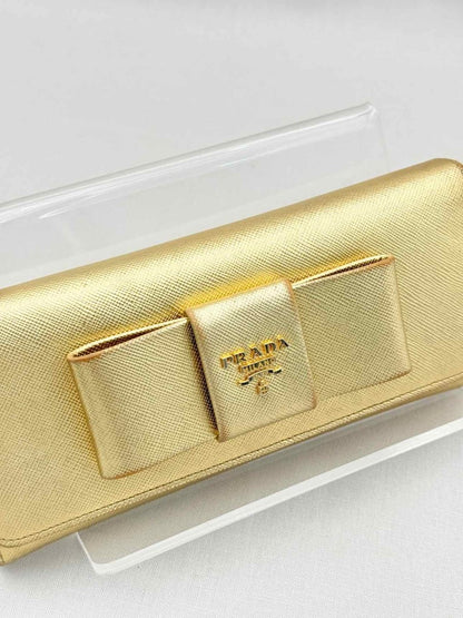 Pre-loved PRADA Gold Continental Wallet at Reems Closet