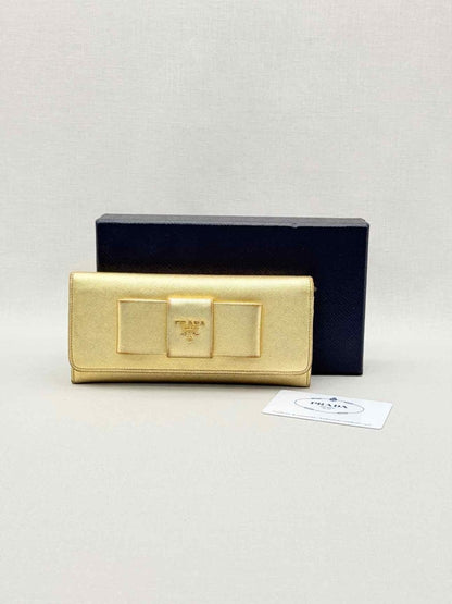 Pre-loved PRADA Gold Continental Wallet at Reems Closet