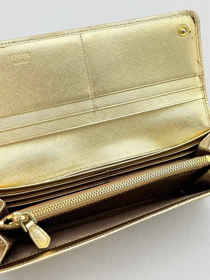 Pre-loved PRADA Gold Continental Wallet at Reems Closet