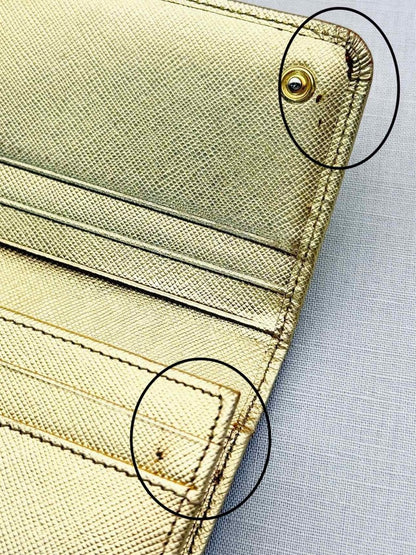 Pre-loved PRADA Gold Continental Wallet at Reems Closet