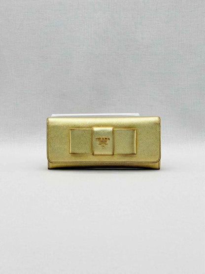 Pre-loved PRADA Gold Continental Wallet at Reems Closet