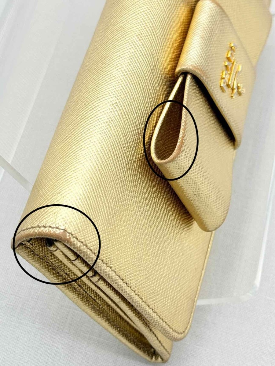 Pre-loved PRADA Gold Continental Wallet at Reems Closet