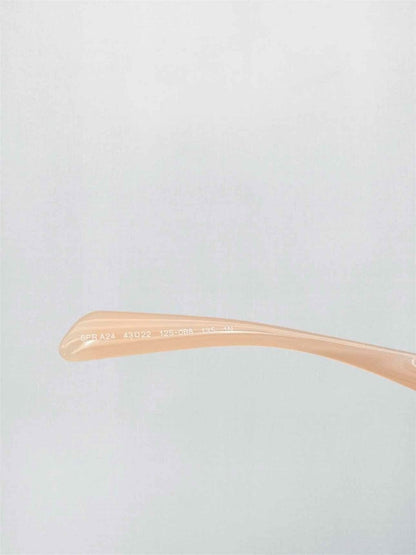 Pre-loved PRADA Peach Sunglasses at Reems Closet