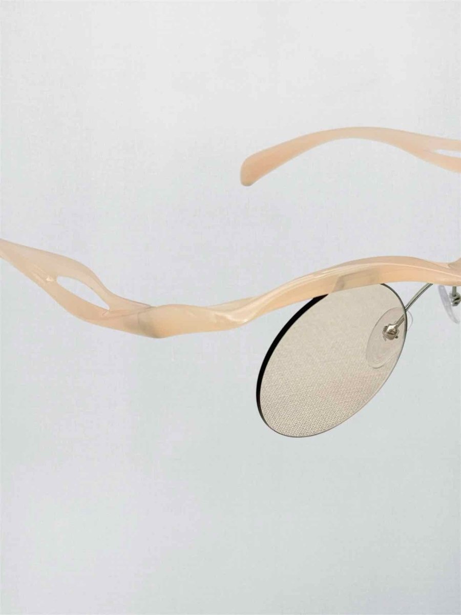 Pre-loved PRADA Peach Sunglasses at Reems Closet