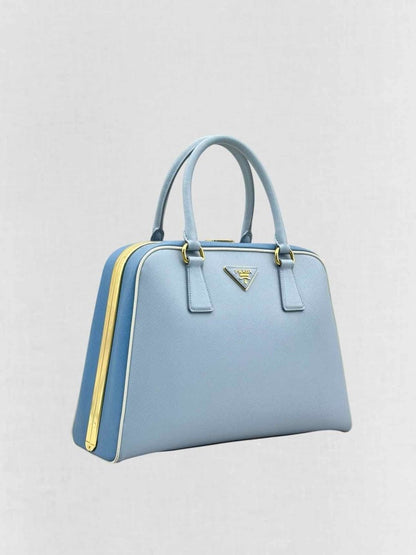 Pre - loved PRADA Pyramid Light Blue Top Handle at Reems Closet