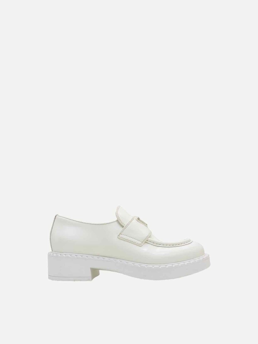 Pre-loved PRADA Slip On White Loafers from Reems Closet