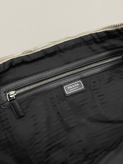 Pre-loved PRADA Triangle Off-white Shoulder Bag at Reems Closet