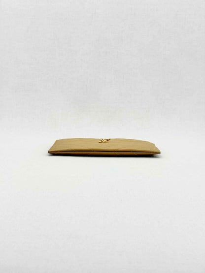 Pre - loved SAINT LAURENT Monogram Beige Quilted Pouch at Reems Closet