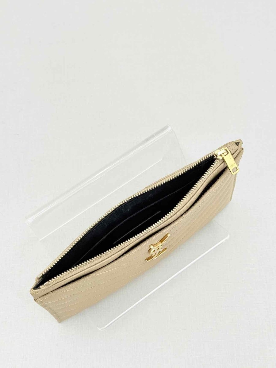 Pre - loved SAINT LAURENT Monogram Beige Quilted Pouch at Reems Closet