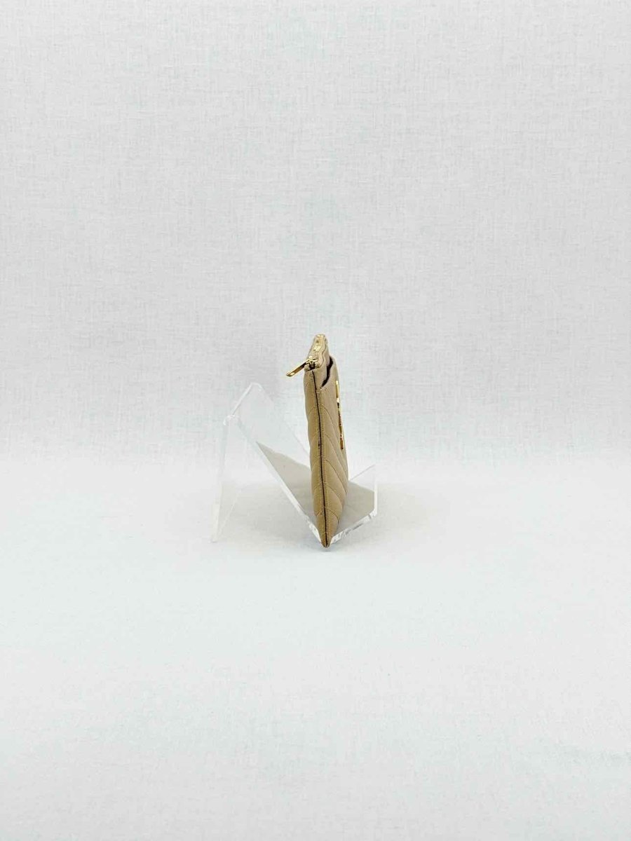 Pre - loved SAINT LAURENT Monogram Beige Quilted Pouch at Reems Closet