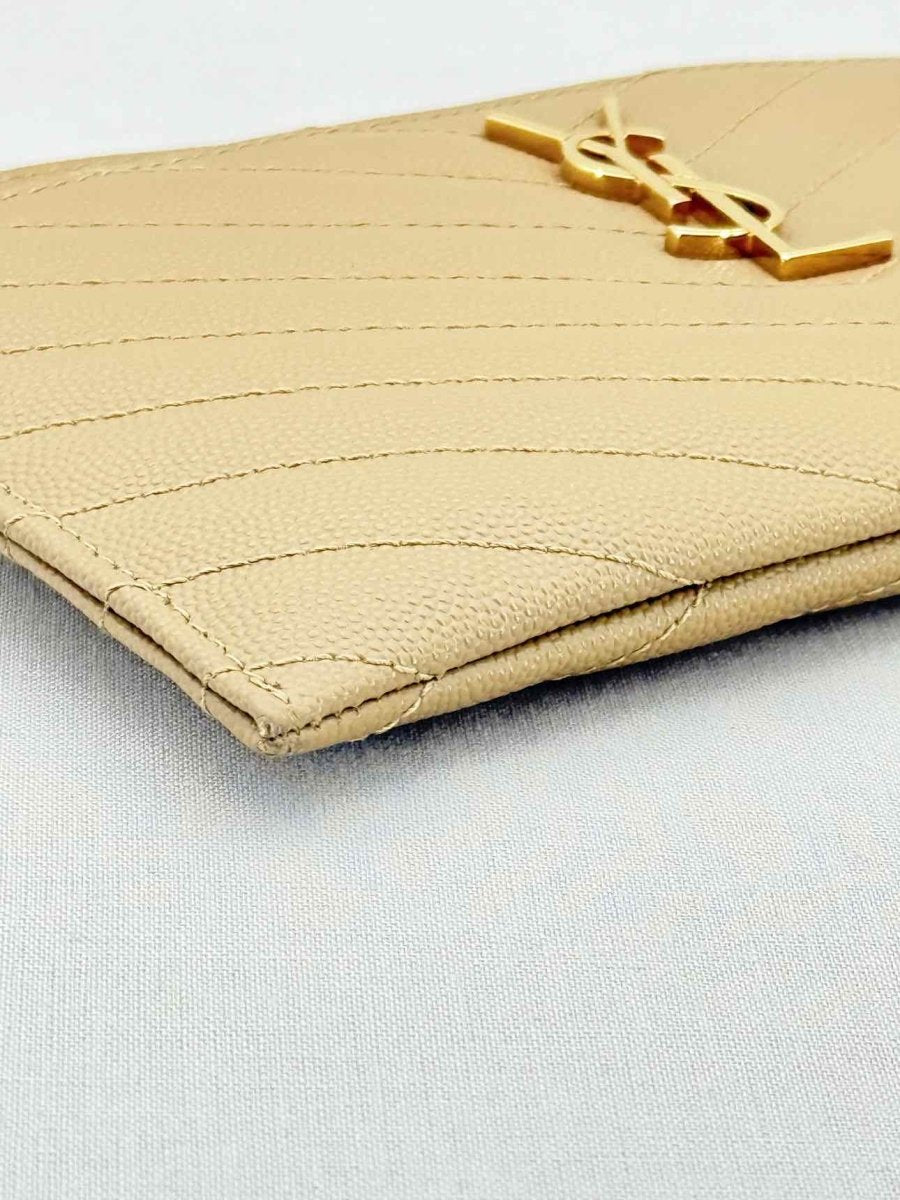Pre - loved SAINT LAURENT Monogram Beige Quilted Pouch at Reems Closet