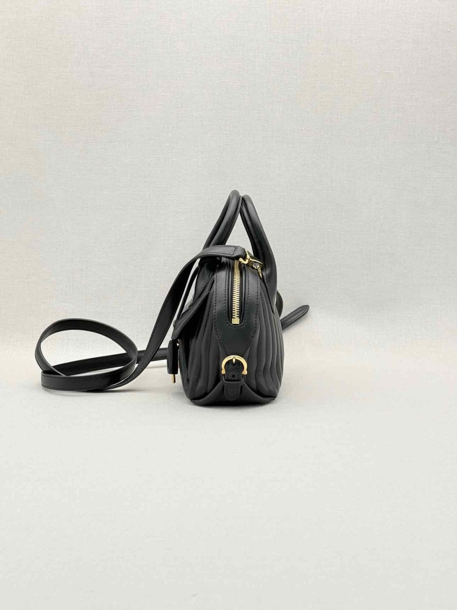 Pre-loved SALVATORE FERRAGAMO Flamma Black Quilted Satchel at Reems Closet