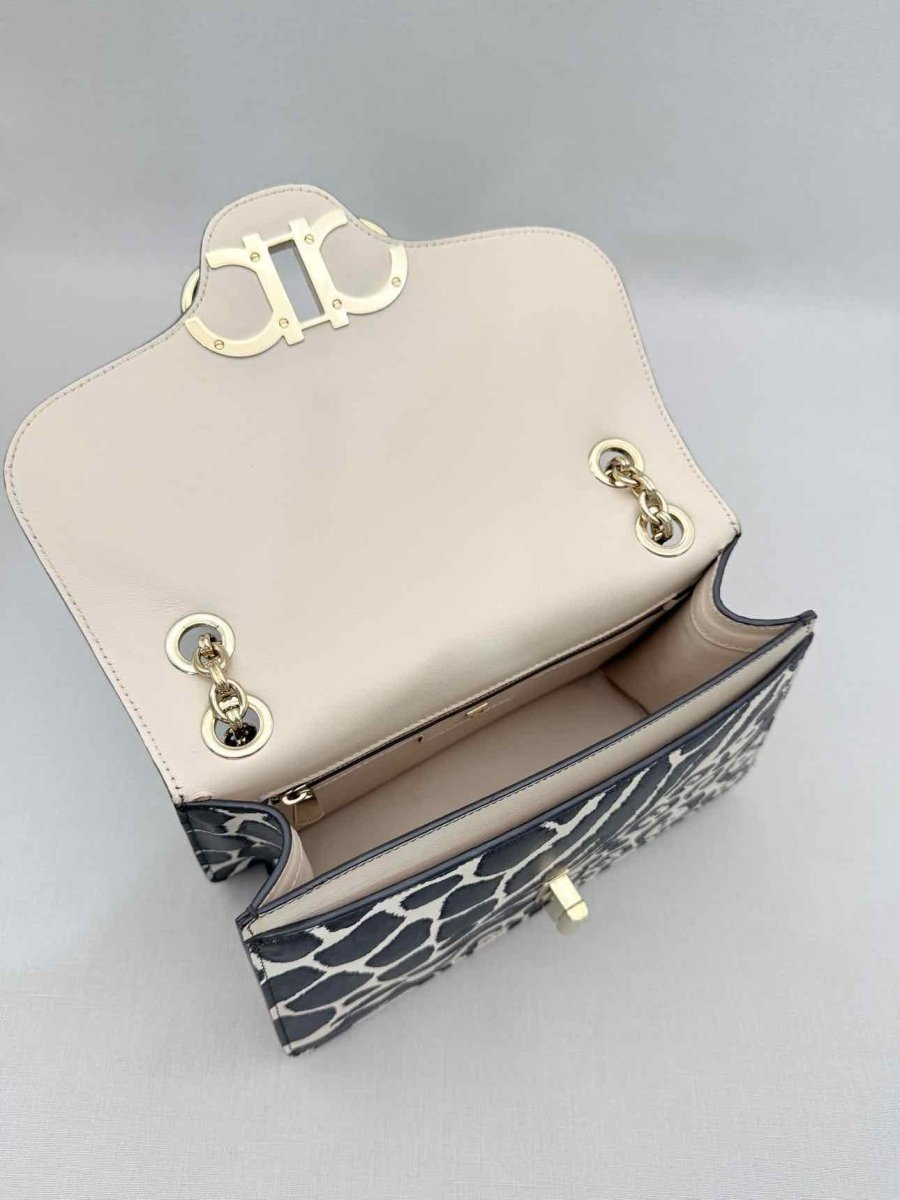 Pre-loved SALVATORE FERRAGAMO Gancini Black & White Shoulder Bag at Reems Closet