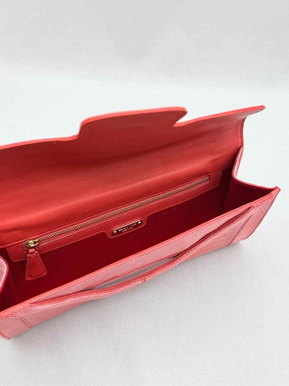 Pre-loved SERGIO ROSSI Coral Lizard Embossed Clutch at Reems Closet