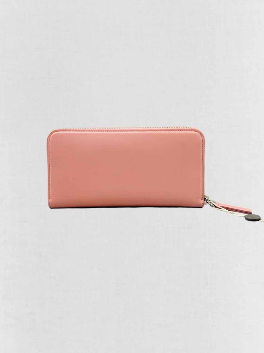 Pre - loved TOD'S Pale Pink Continental Wallet at Reems Closet