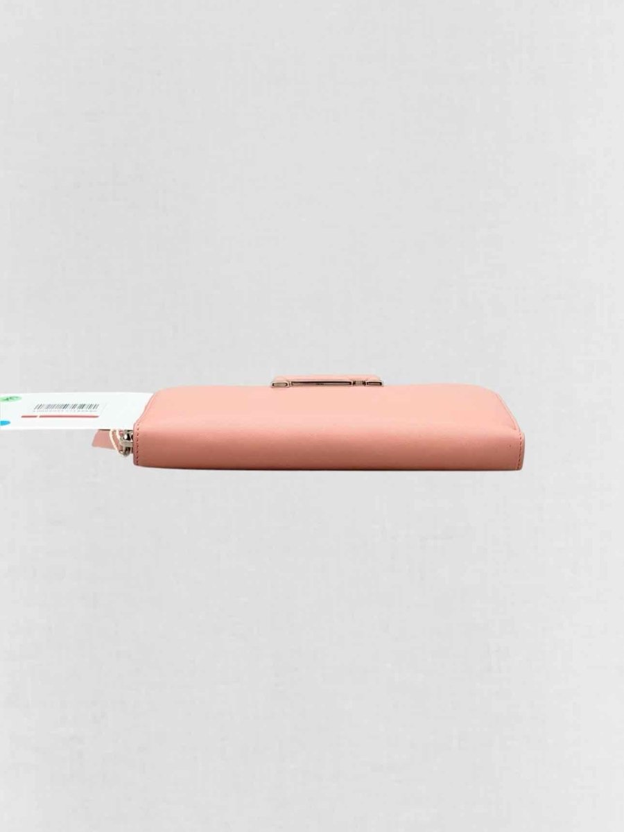Pre - loved TOD'S Pale Pink Continental Wallet at Reems Closet