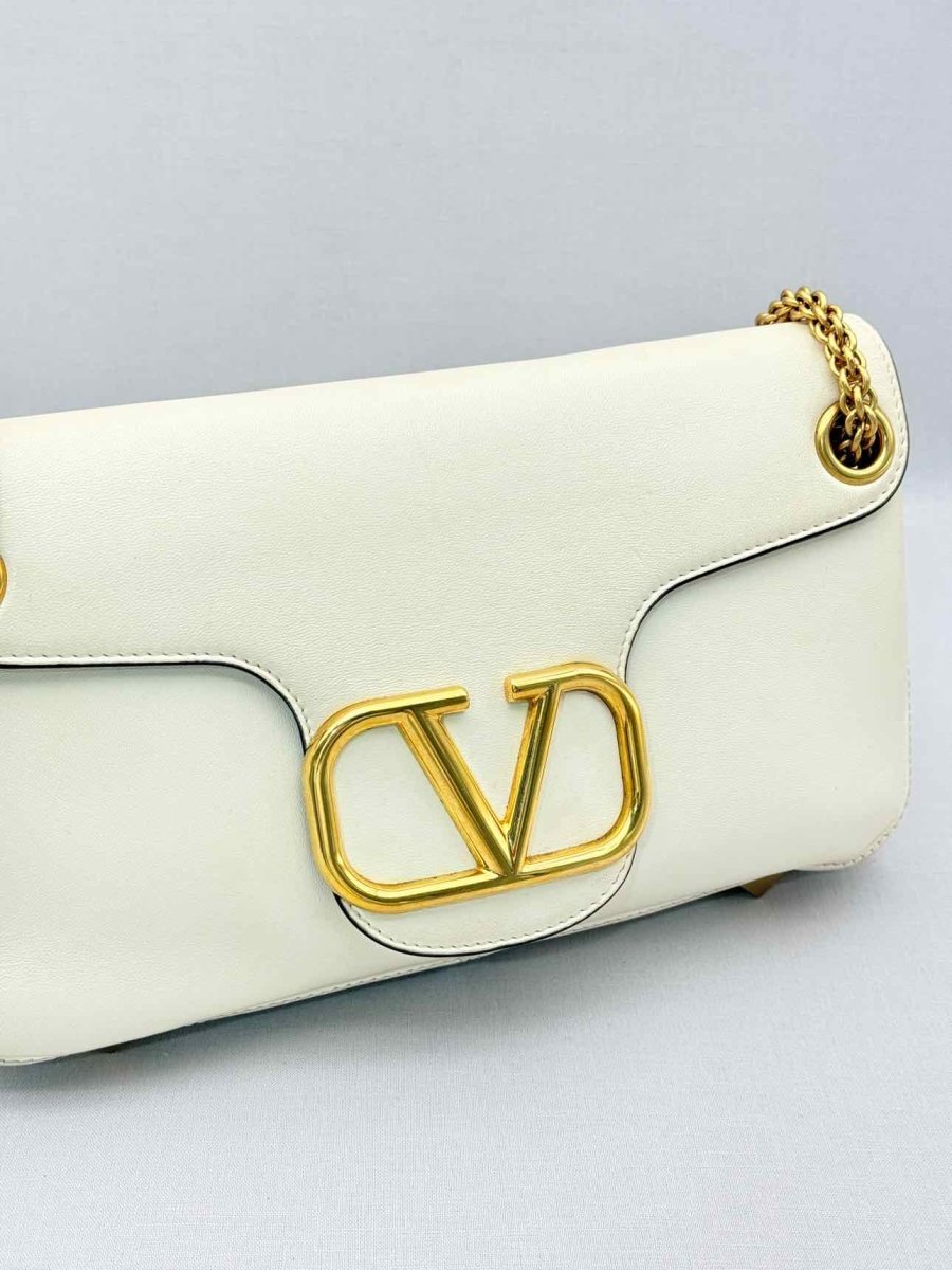 Pre-loved VALENTINO GARAVANI Stud Sign Cream Shoulder Bag at Reems Closet