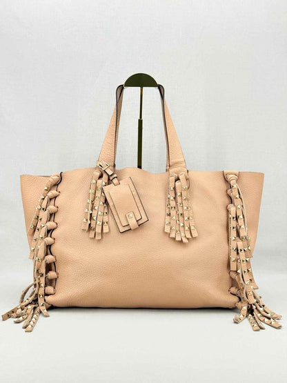 Pre - loved VALENTINO Rockstud Nude Fringed Tote Bag at Reems Closet