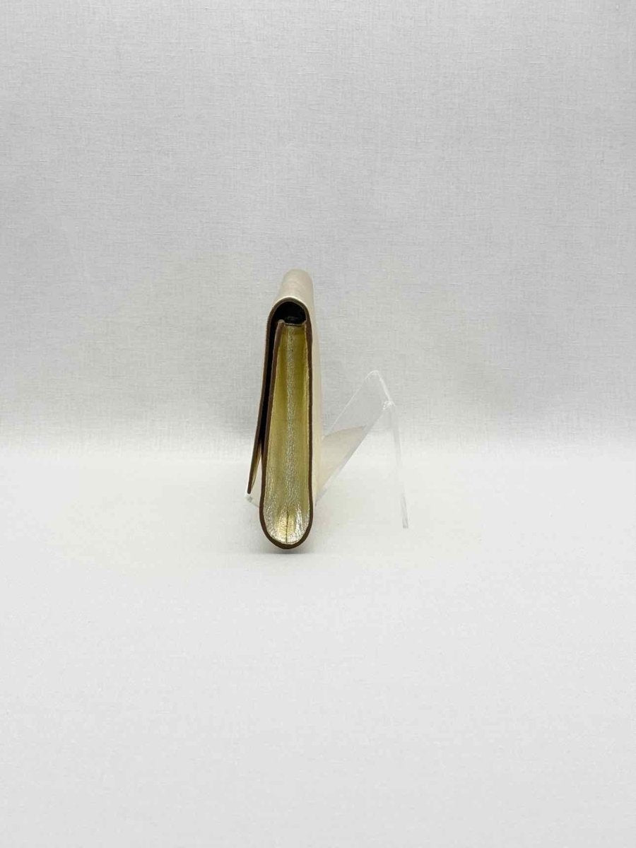 Pre-loved YVES SAINT LAURENT Belle De Jour Metallic Gold Clutch at Reems Closet