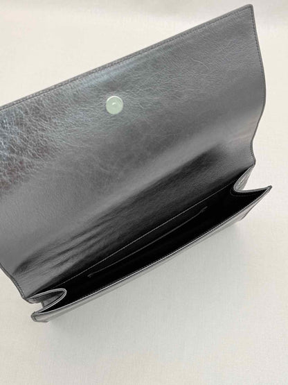 Pre-loved YVES SAINT LAURENT Belle De Jour Metallic Grey Clutch at Reems Closet