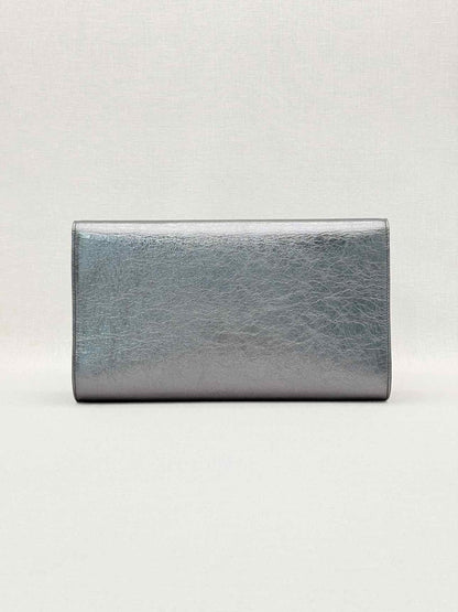 Pre-loved YVES SAINT LAURENT Belle De Jour Metallic Grey Clutch at Reems Closet