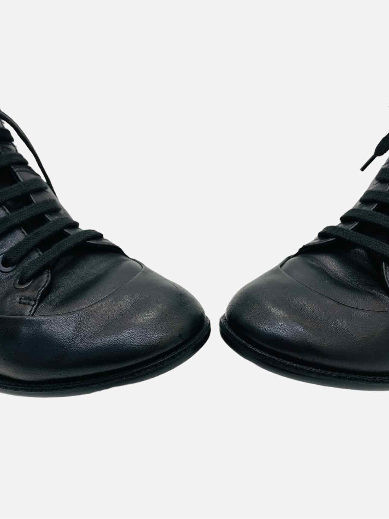 Pre - loved CHANEL High Top Black Quilted Sneakers at Reems Closet