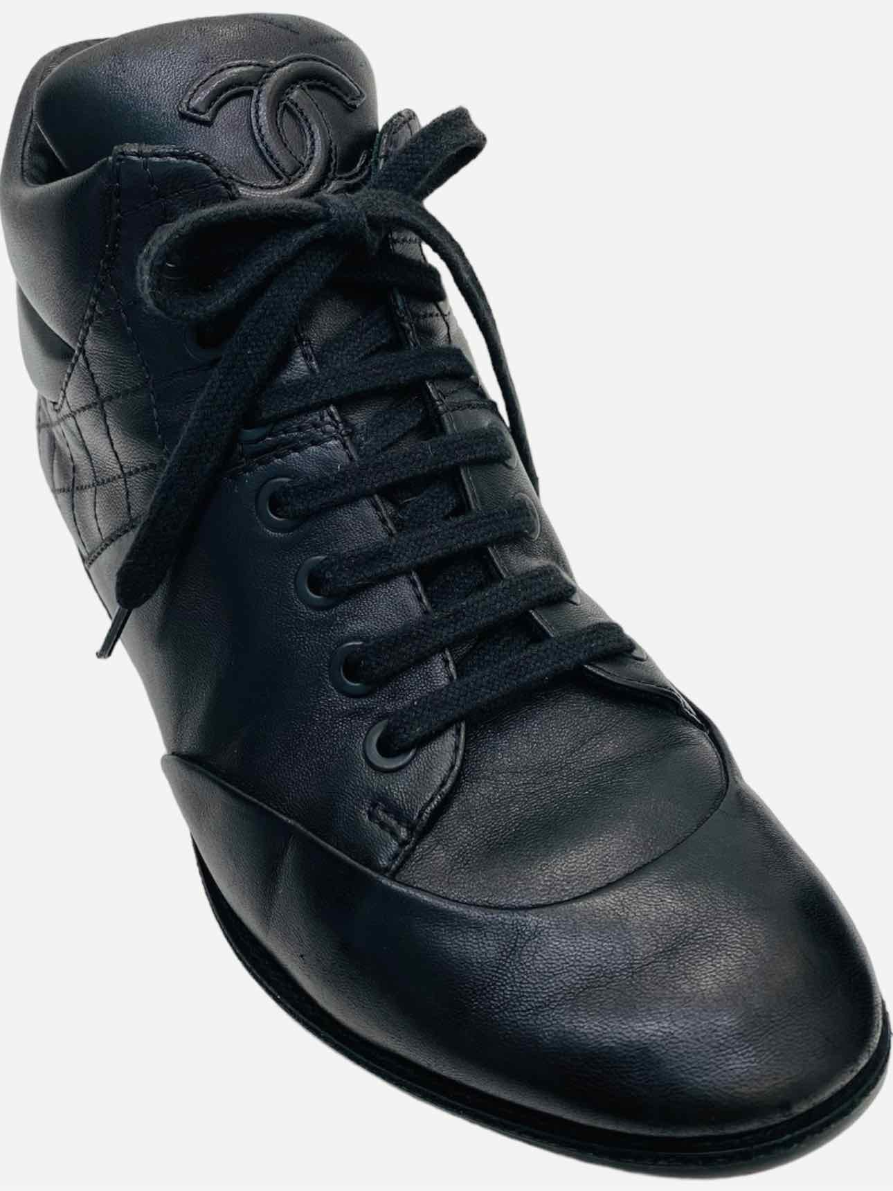 Pre - loved CHANEL High Top Black Quilted Sneakers at Reems Closet