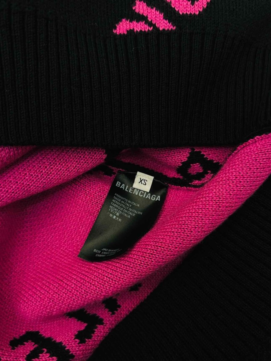 Pre-loved BALENCIAGA Black & Pink All-over Logo Jumper from Reems Closet