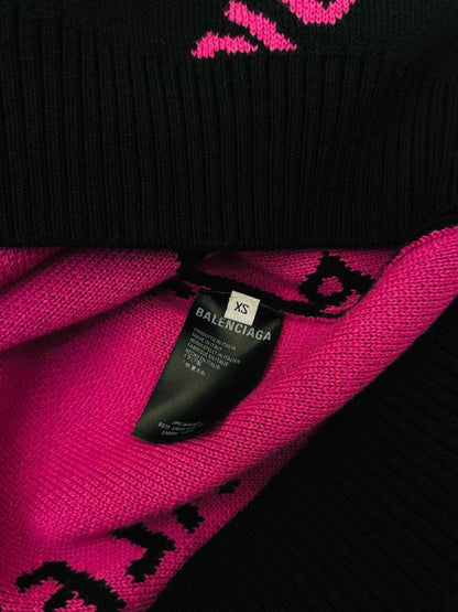 Pre-loved BALENCIAGA Black & Pink All-over Logo Jumper from Reems Closet