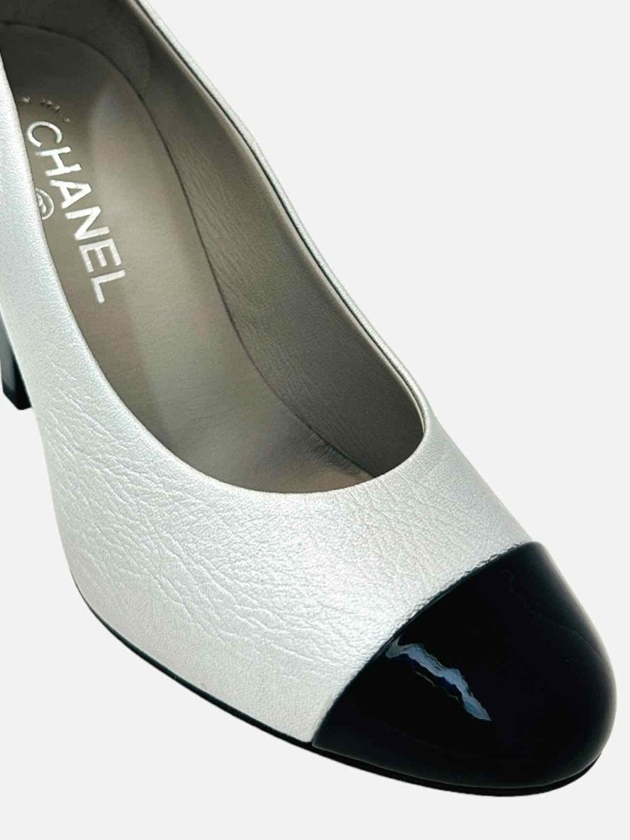 Pre-loved CHANEL Metallic Silver & Black Cap Toe Pumps from Reems Closet