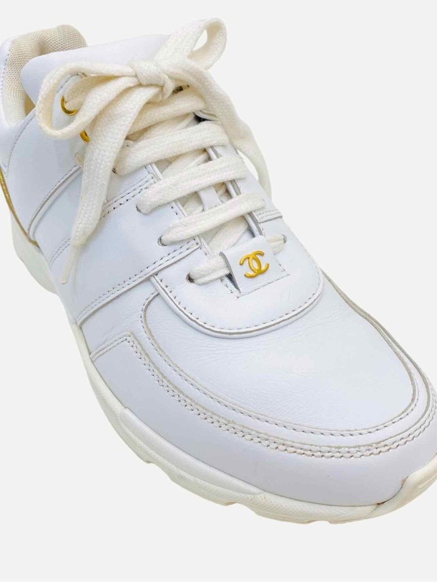 Pre-loved CHANEL White w/ Gold Sneakers from Reems Closet