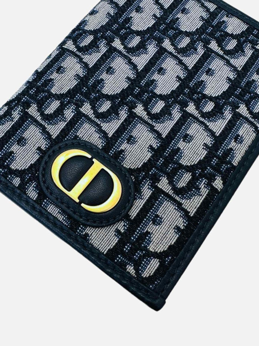 Pre-loved DIOR 30 Montaigne Blue Oblique Jacquard Passport Holder from Reems Closet