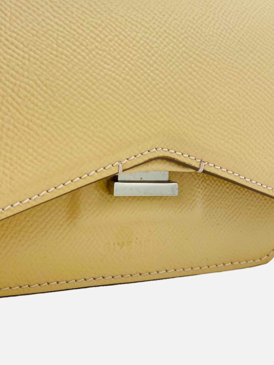Pre-loved GIVENCHY Bow Cut Beige Clutch - Reems Closet