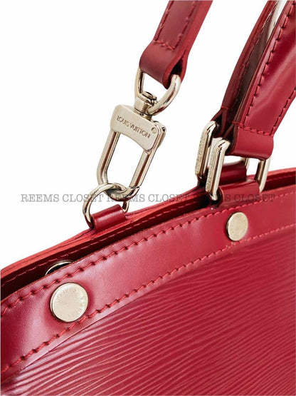 Pre - loved LOUIS VUITTON Brea Red Top Handle at Reems Closet