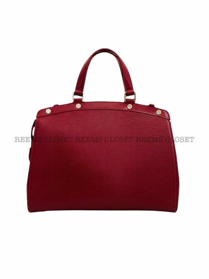 Pre - loved LOUIS VUITTON Brea Red Top Handle at Reems Closet