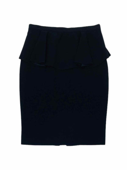 Pre - loved ST. JOHN Peplum Black Knee Length Skirt at Reems Closet