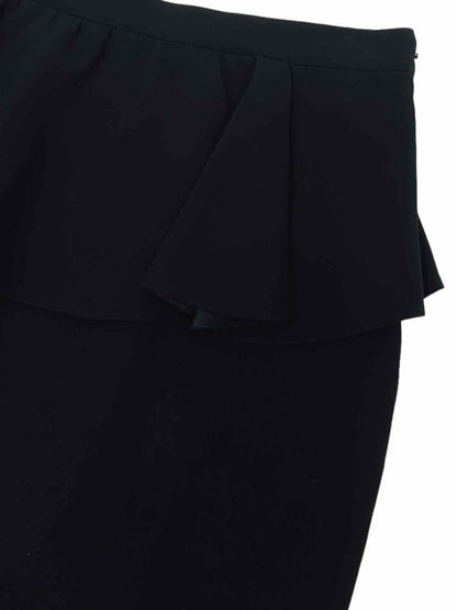 Pre - loved ST. JOHN Peplum Black Knee Length Skirt at Reems Closet